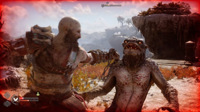 Kratos punches a monster in God Of War Ragnarok.