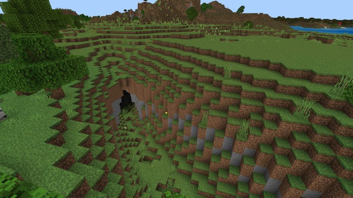 Screenshot of a Minecraft Bedrock plains biome, with a cave entrance in the foreground.