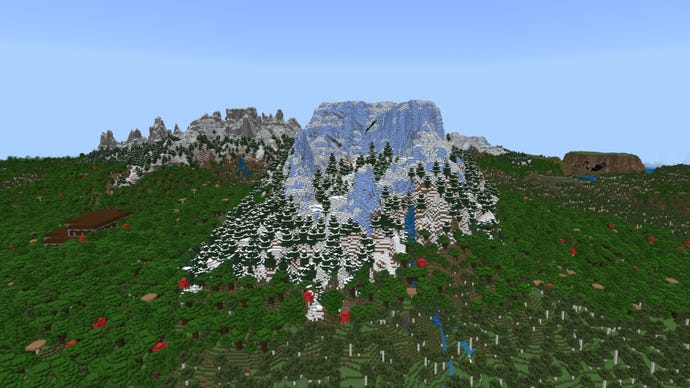 Screenshot of a large icy mountain rises out of a forest landscape in a Minecraft Bedrock world.